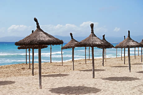 Beach with umbrellas in palma de mallorca photo