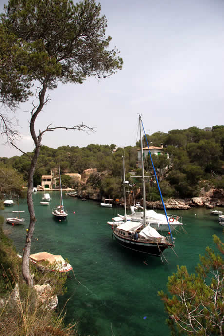 Boats in the bay of cala figuera majorca photo
