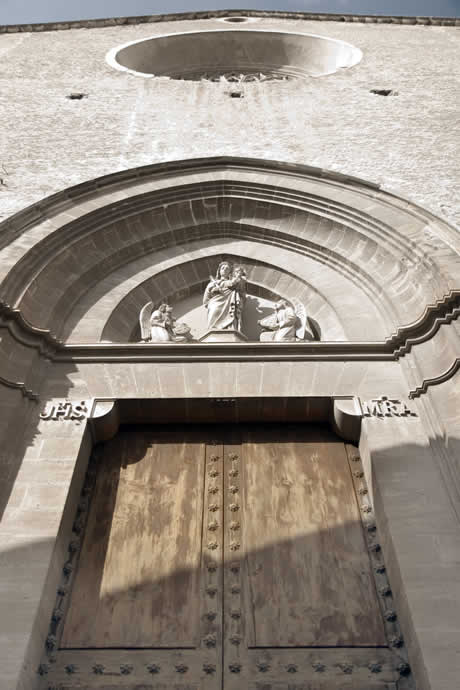 Facade of pollensa church in majorca spain photo