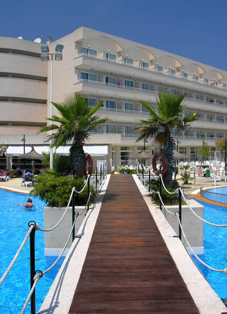 Wooden bridge across a hotel swimming pool in mallorca photo